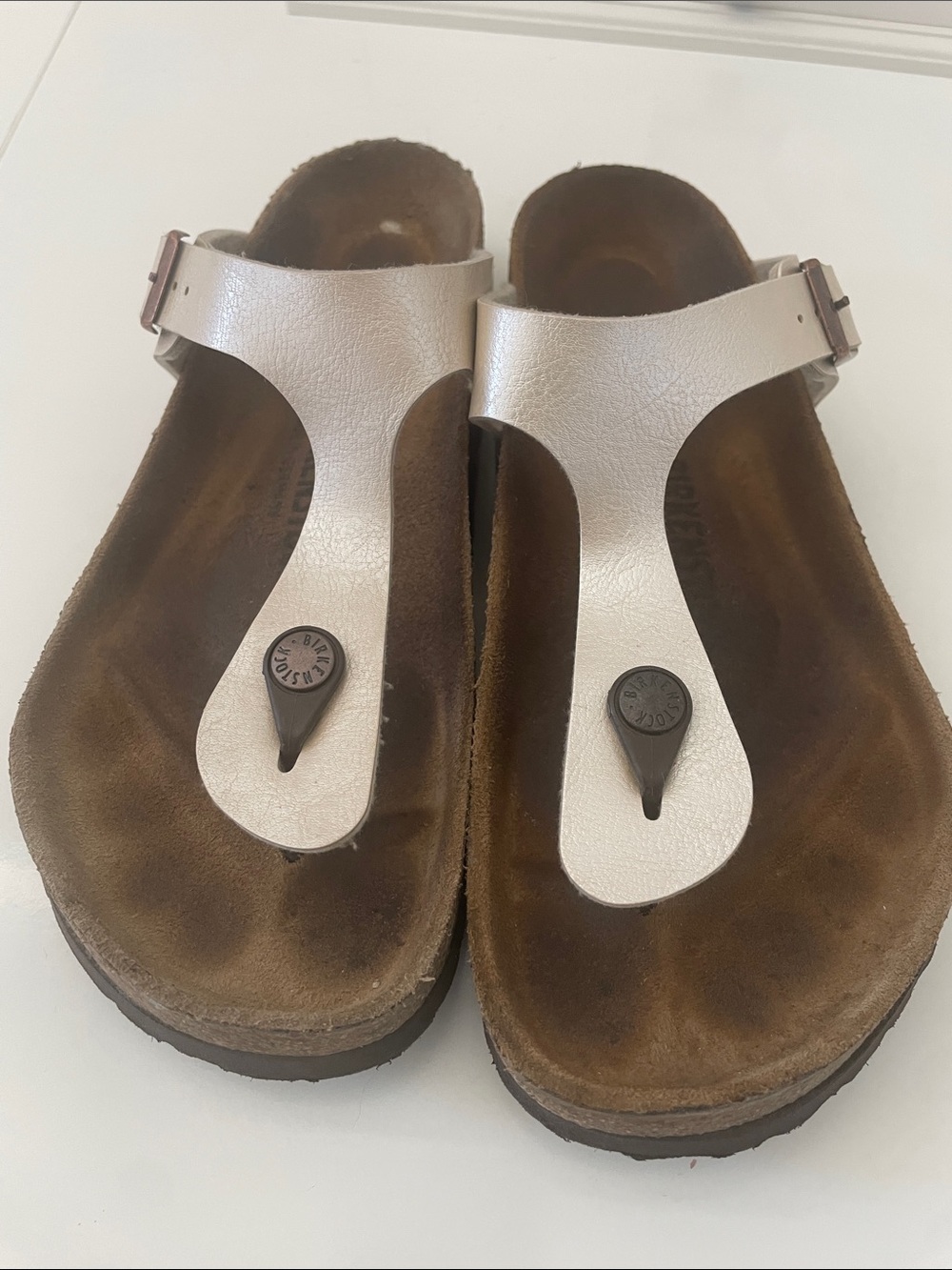 Birkenstock Gizeh Pearl Cream Leather Sandals w/ Copper Tone Buckles. Almost new